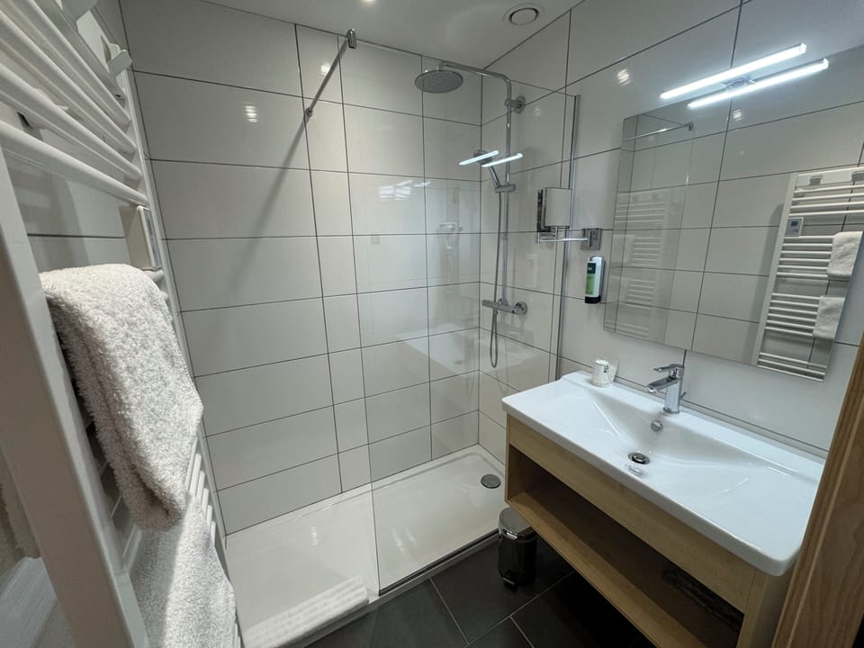Comfort Room | Bathroom | Shower, hair dryer, towels, soap