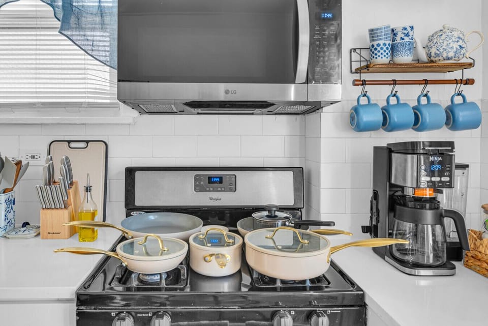 Kitchen | White Cabinetry, Gas Stove & Fully Equipped Setup
