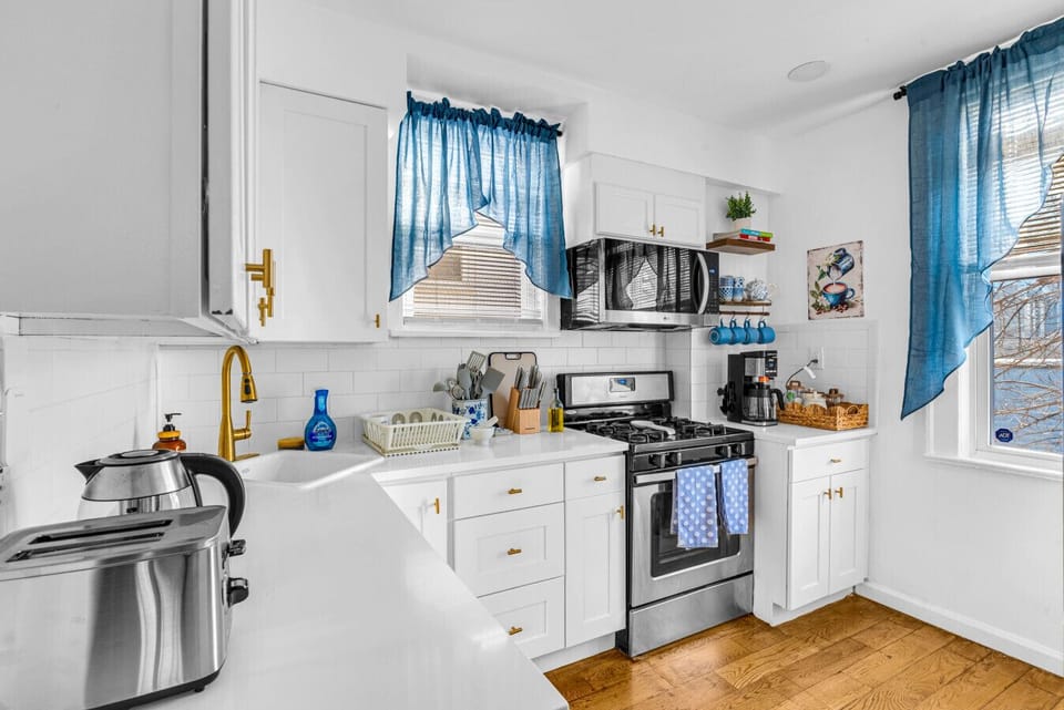 Kitchen | White Cabinetry, Gas Stove & Fully Equipped Setup
