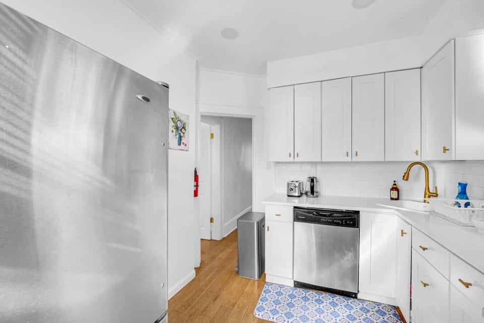 Kitchen | White Cabinetry, Gas Stove & Fully Equipped Setup