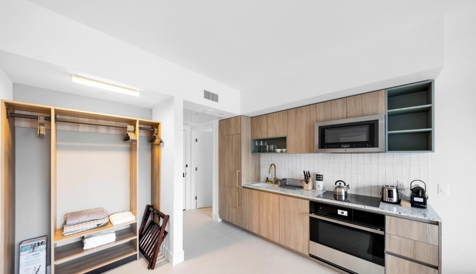 Condo, Balcony, City View | Private kitchen | Espresso maker, eco-friendly cleaning products, ice maker, paper towels