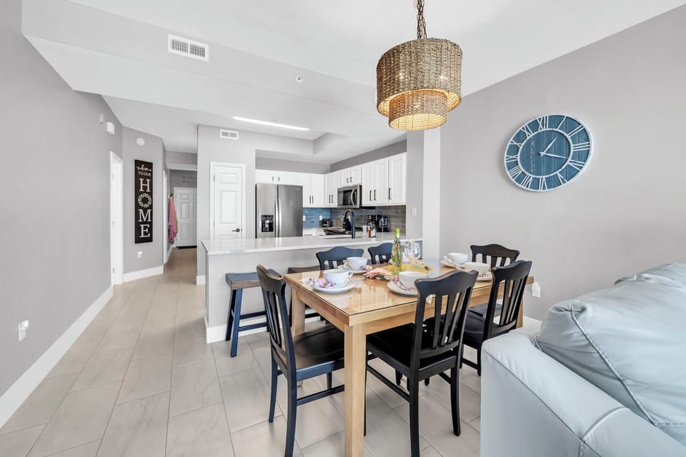 Your open dining area flows seamlessly into a refined kitchen space, perfect for unforgettable meals together.
