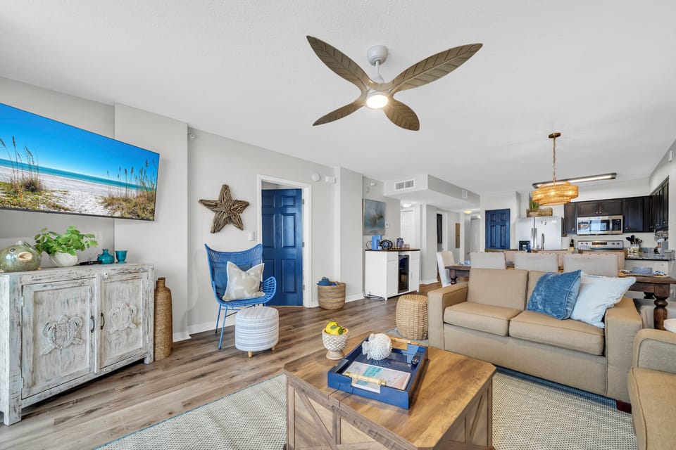 Settle into coastal comfort with beachy decor, a breezy ceiling fan, and an open layout that flows into your fully equipped kitchen—perfect for relaxing after a day by the shore.