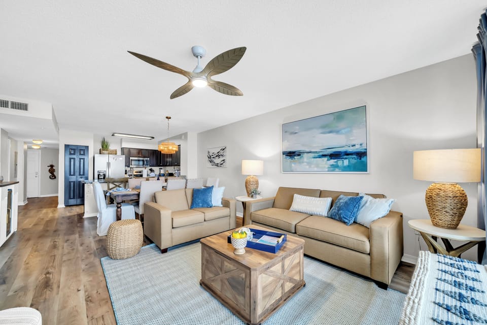 Unwind in your inviting living space where coastal-inspired décor and plush seating create the perfect ambiance for relaxation and memorable evenings together.