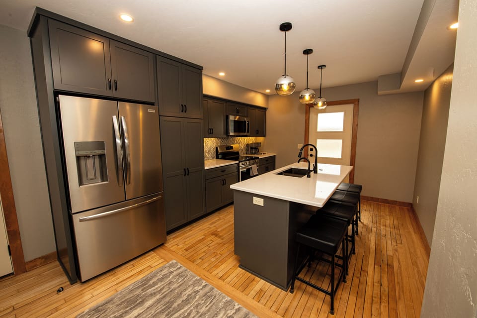 Kitchen  with exit to back deck with view of the Mullet River