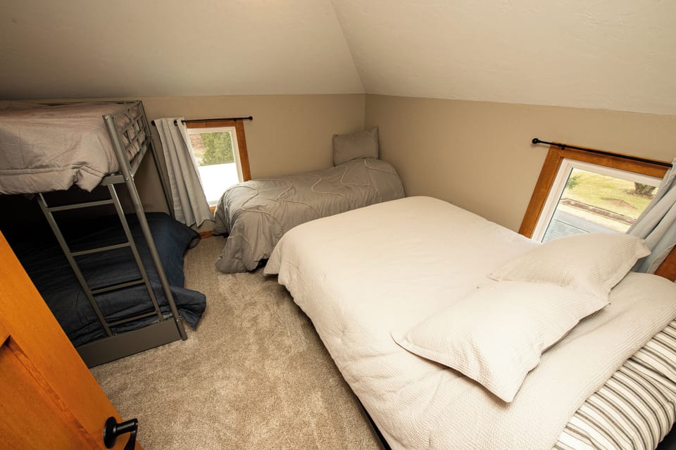 Upstairs bedroom #2 with full bunks, queen and twin