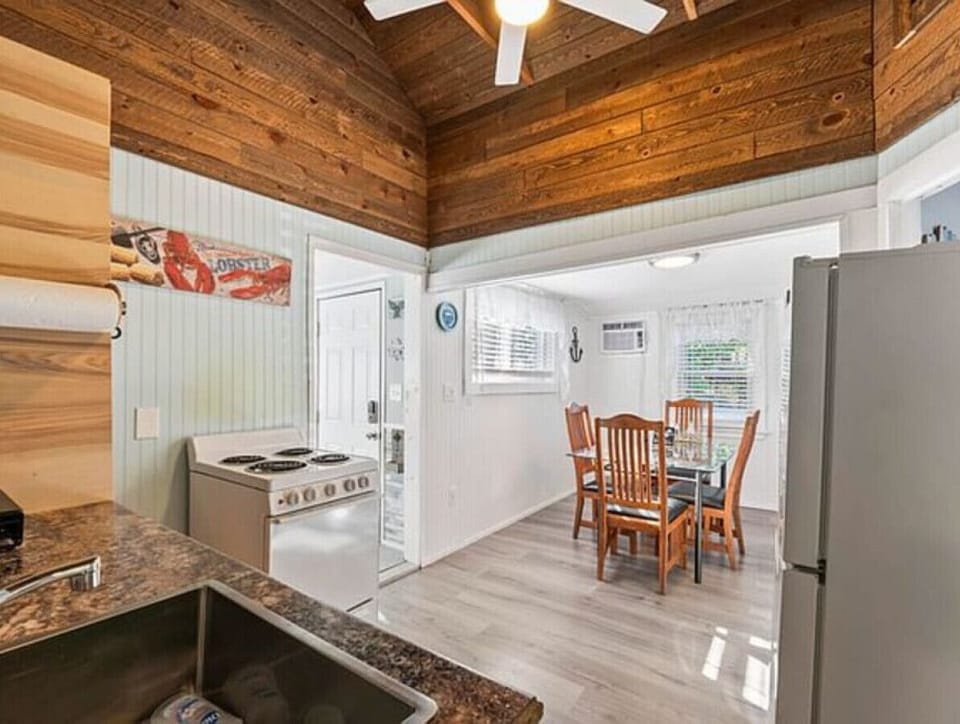 Kitchen | Electric Range | Dining Table & Wood Ceiling