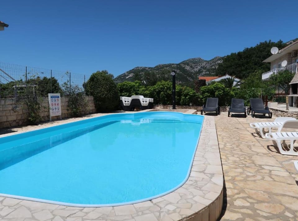 House (Four Bedroom Holiday Home with Terrac) | Outdoor pool | Seasonal outdoor pool