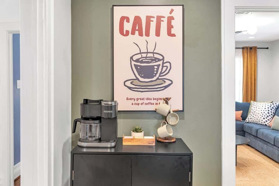 Coffee Corner: Brew your favorite blend with modern appliances and a charming wall art backdrop!