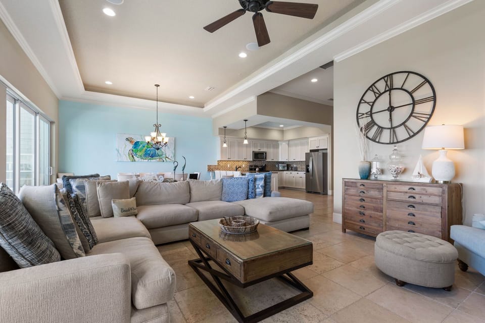 The day slows here, where soft seats gather everyone close and the kitchen hums with easy conversation. Time feels unhurried as laughter drifts from room to room, creating those simple, lasting moments that bring the whole family together.