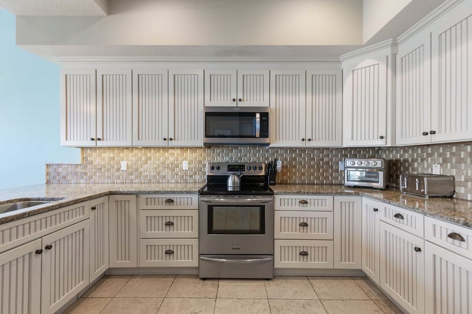 Evenings come alive here, where favorite recipes fill the air and everyone gathers close, sharing stories between bites. From quick breakfasts to long dinners, this kitchen quietly becomes the backdrop for the moments your family will remember most.