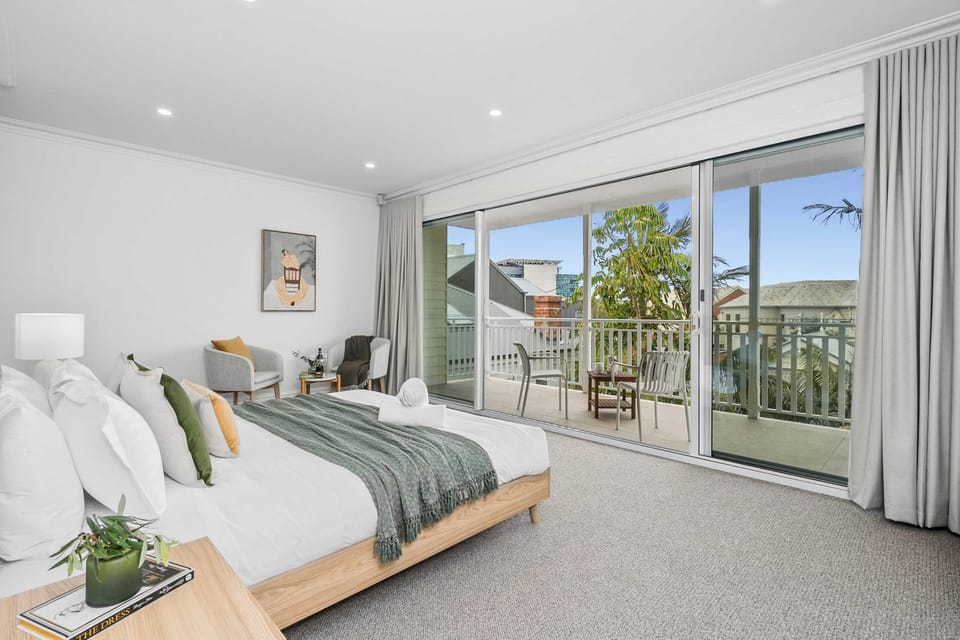 Master retreat with king bed, balcony and natural light