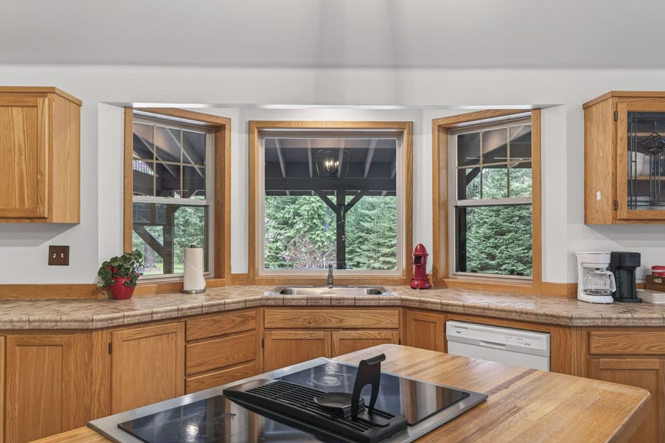 Warm wood cabinetry, big windows, and a kitchen that feels like home