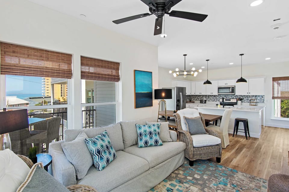 Relax in your bright, coastal-inspired living space where modern comfort meets beach vibes, with ocean views from your private balcony.