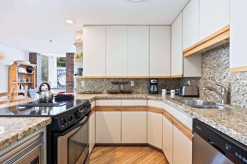 Well-appointed kitchen with modern appliances, ample counter space, and everything needed to prepare meals.
