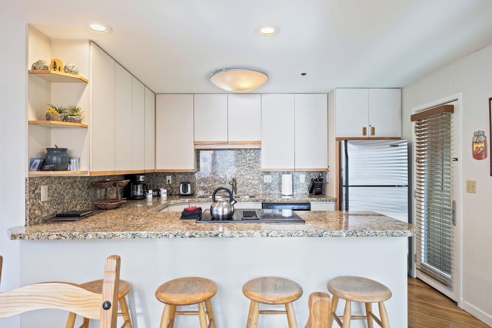Modern kitchen with ample counter space, updated appliances, and a convenient breakfast bar for casual dining.