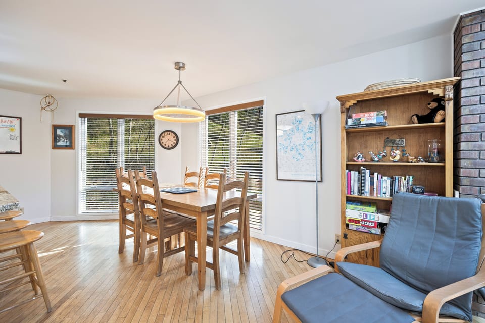 Open dining space with large windows, creating a bright and welcoming setting for meals and gatherings.