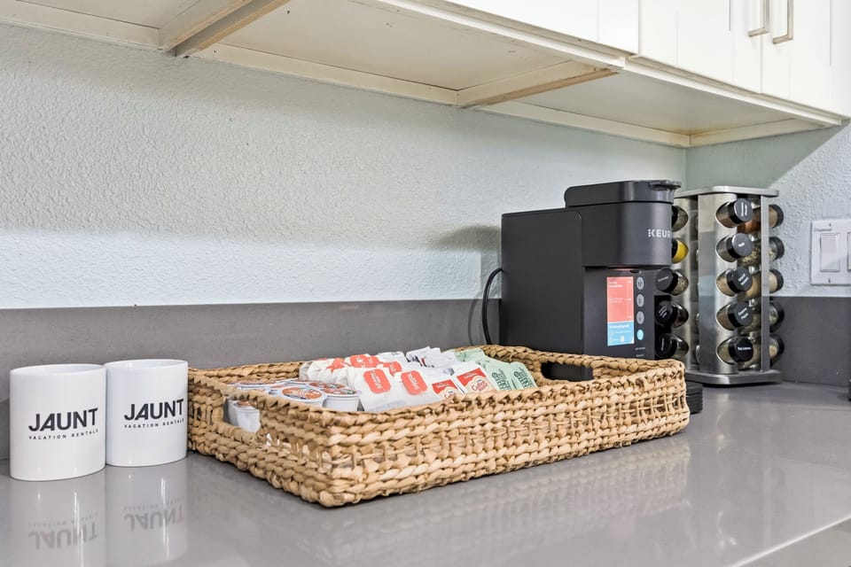 Convenient kitchen coffee station with countertop space and essentials, perfect for starting your day.
