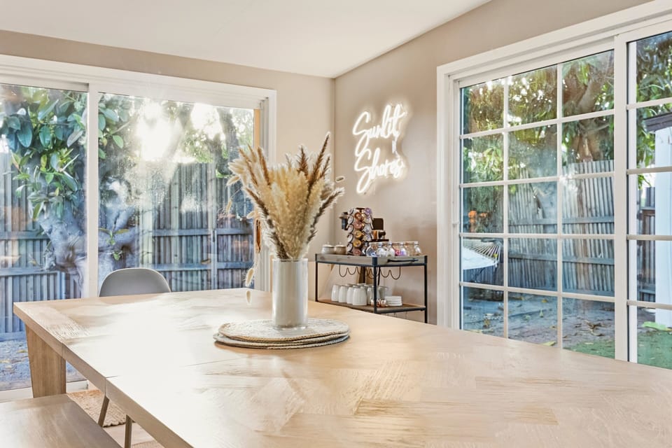 Charming dining area with direct access to the backyard, perfect for indoor-outdoor entertaining.