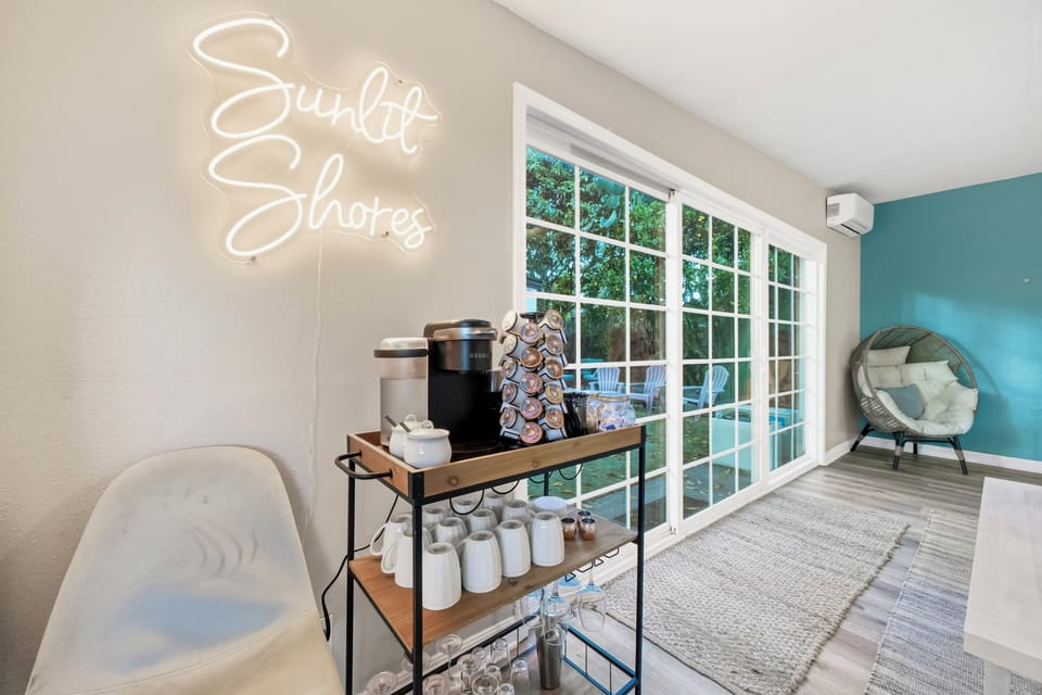 Welcoming entry area featuring a charming coffee station and modern décor, setting the tone for a comfortable stay.