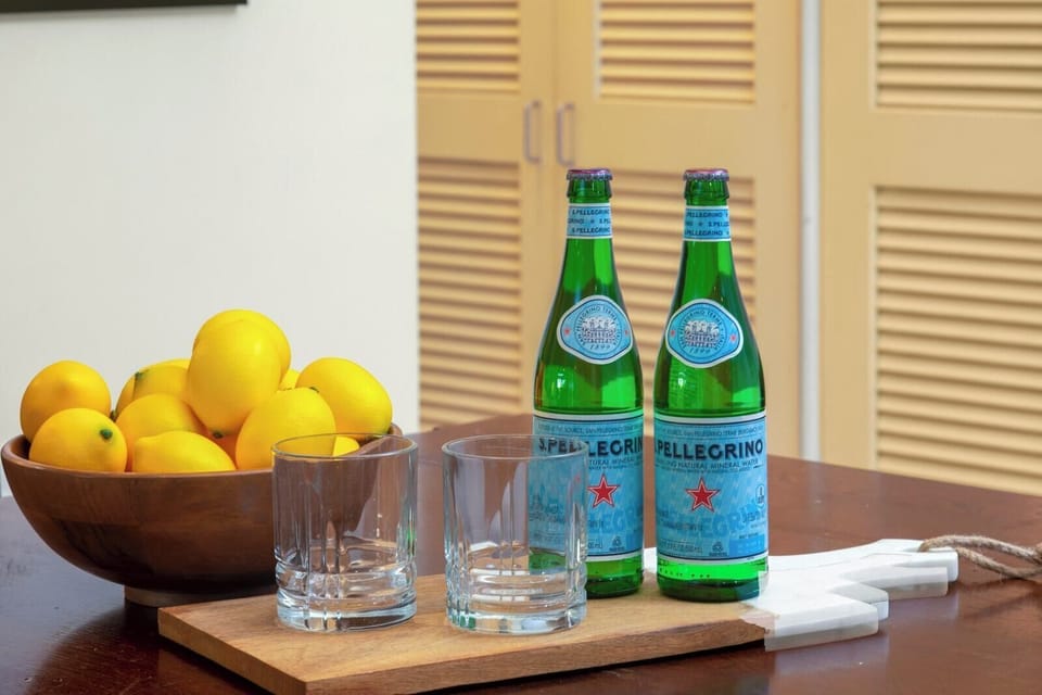  A welcoming touch of zest and sparkle—fresh lemons and chilled San Pellegrino set the mood for island indulgence    KRO-Q102
