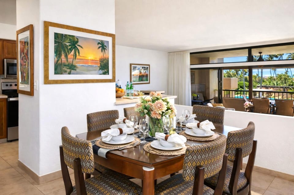 Set with woven grace, blooming florals, and soft natural light, this table invites stories, sips, and island bites     KRO-G201