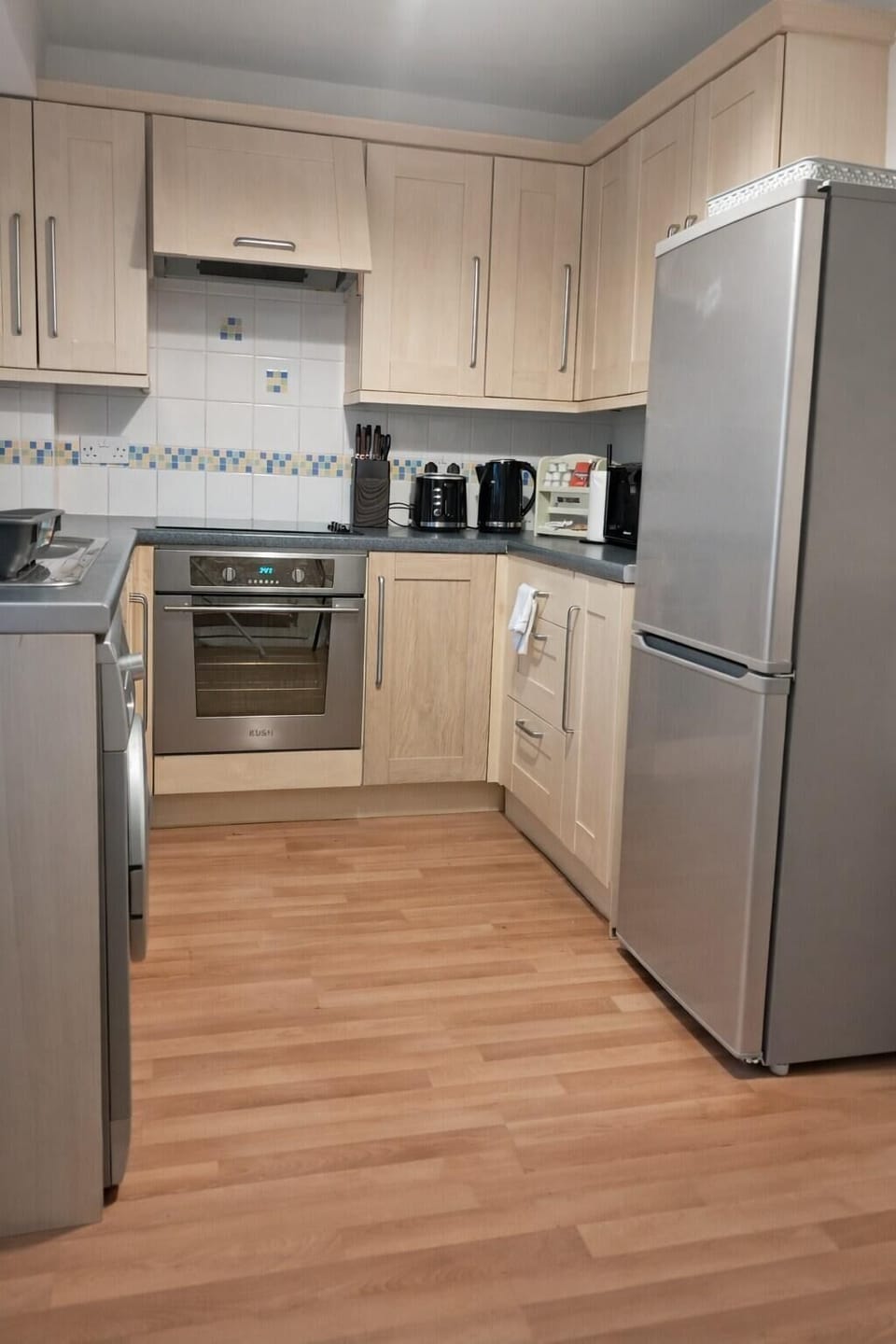 Kitchen stokes with beverages, essential amenities, cutleries, cookware, dishes etc