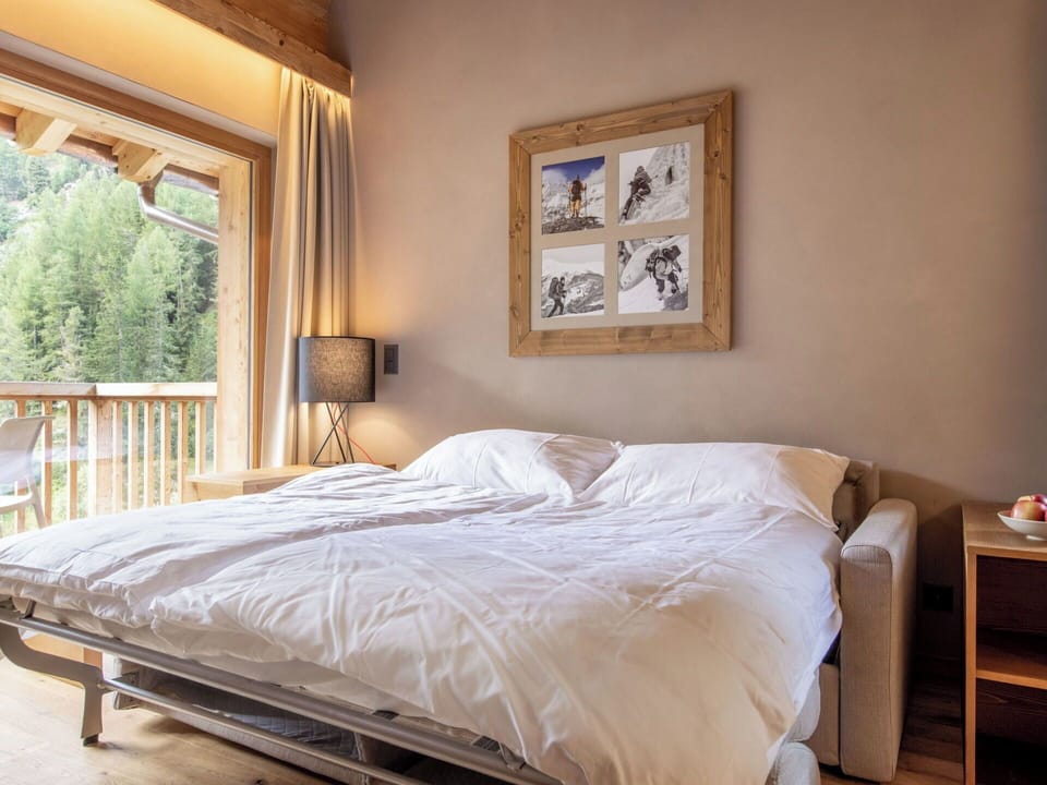 Furniture, Interior Design, Wood, Flooring, Floor, Linens, Bed, Textile, Room, Bedroom