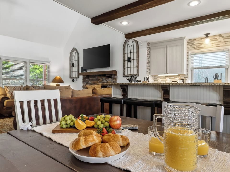 Breakfast bar area with views into the living room and fireplace.