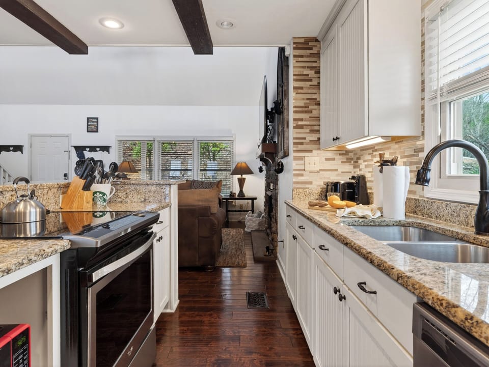 View through the kitchen toward the breakfast bar and living room.