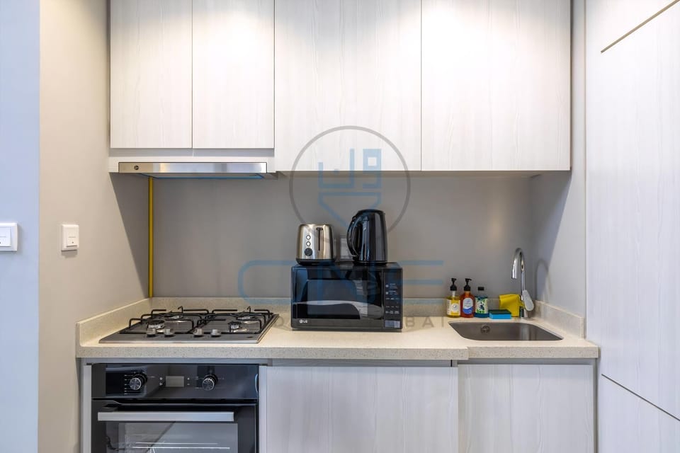 Kitchen: Appliances ( 4 Burner Cooker + Microwave, Kettle, Toaster)