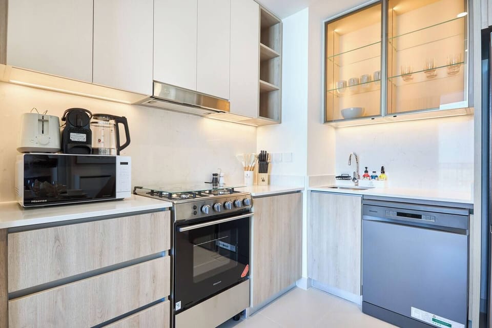 Sleek minimalist kitchen with all essentials for home cooking