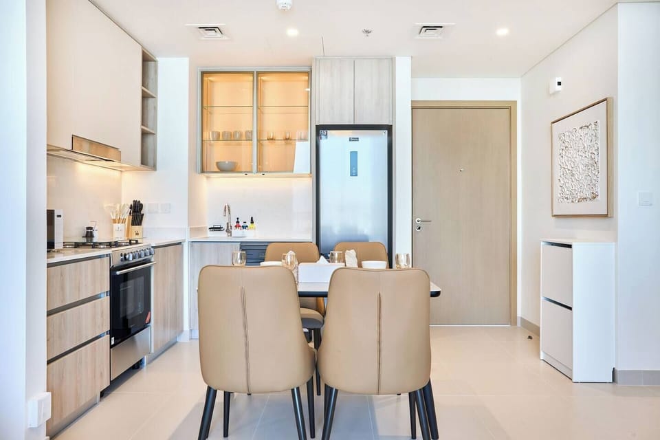 Dining table for four set within a minimalist kitchen