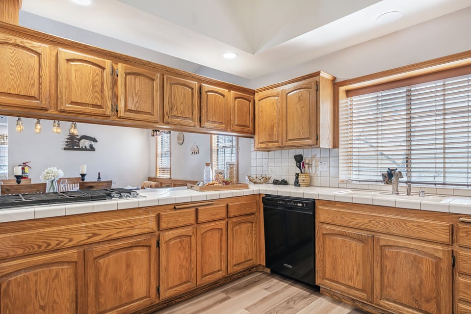 Well-equipped kitchen with generous counter space and a convenient pass-through to the dining area.