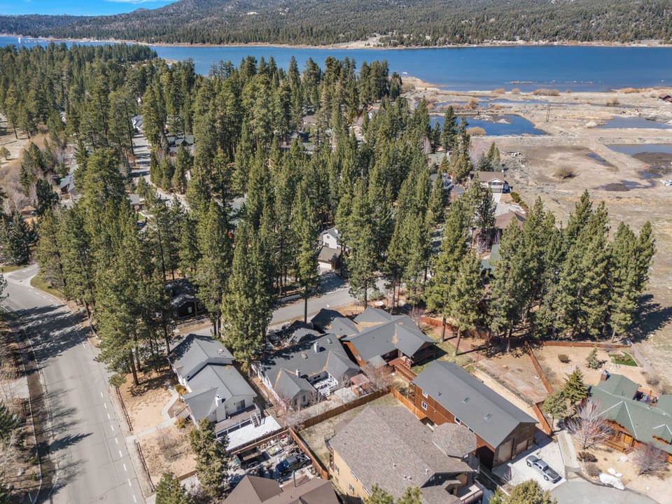 Aerial view of the home nestled among towering pines just moments from the shores of Big Bear Lake.