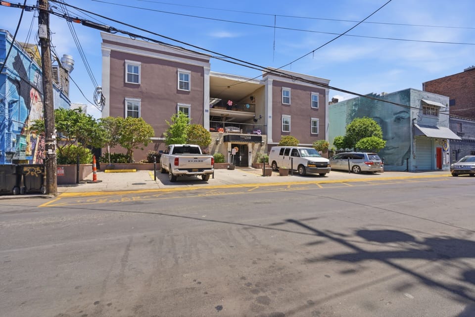 Charming multi-unit building nestled in a quiet residential street.
