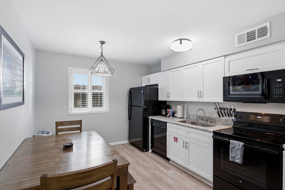 Clean, modern kitchen fully set up for home-cooked meals.
