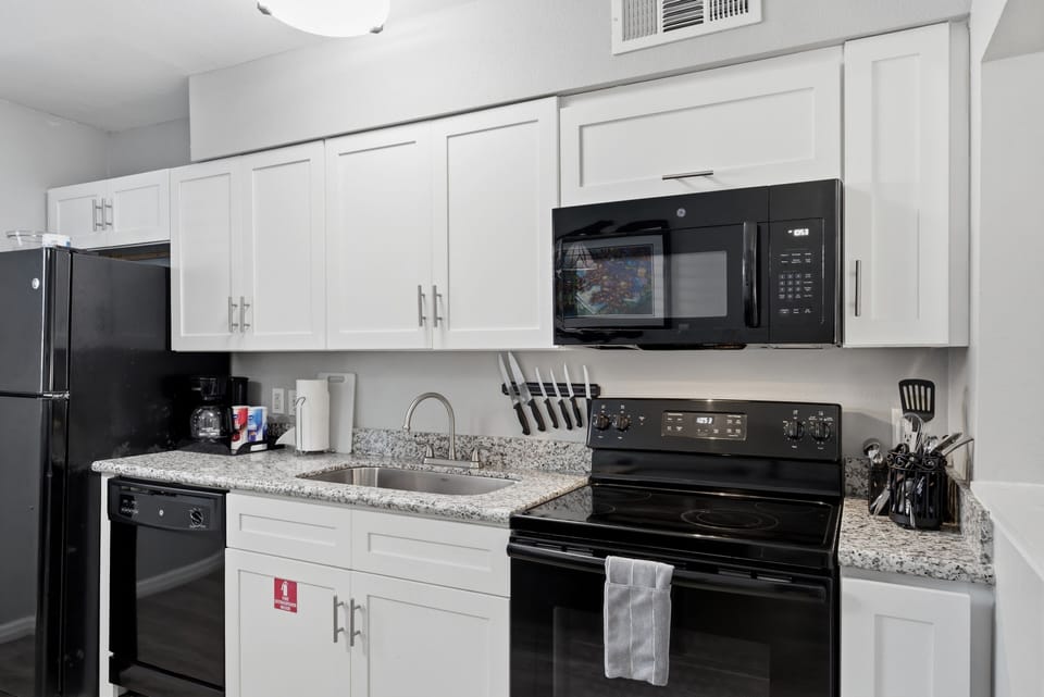 Fully equipped kitchen w/ modern appliances ready for any meal.
