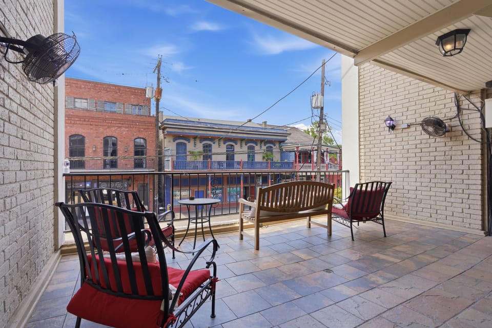 Balcony w/ front-row views of the lively French Quarter streets
