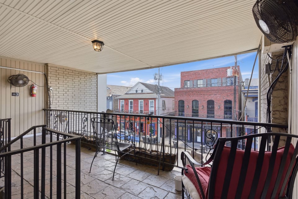 Balcony w/ a front-row seat to the lively French Quarter energy below.
