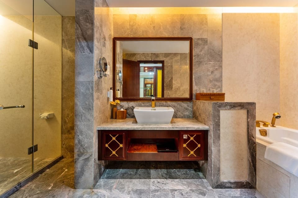 Superior Family Room | Bathroom | Hair dryer, towels, soap, shampoo