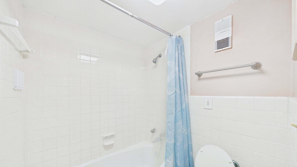 Full bathroom with shower and tub combo