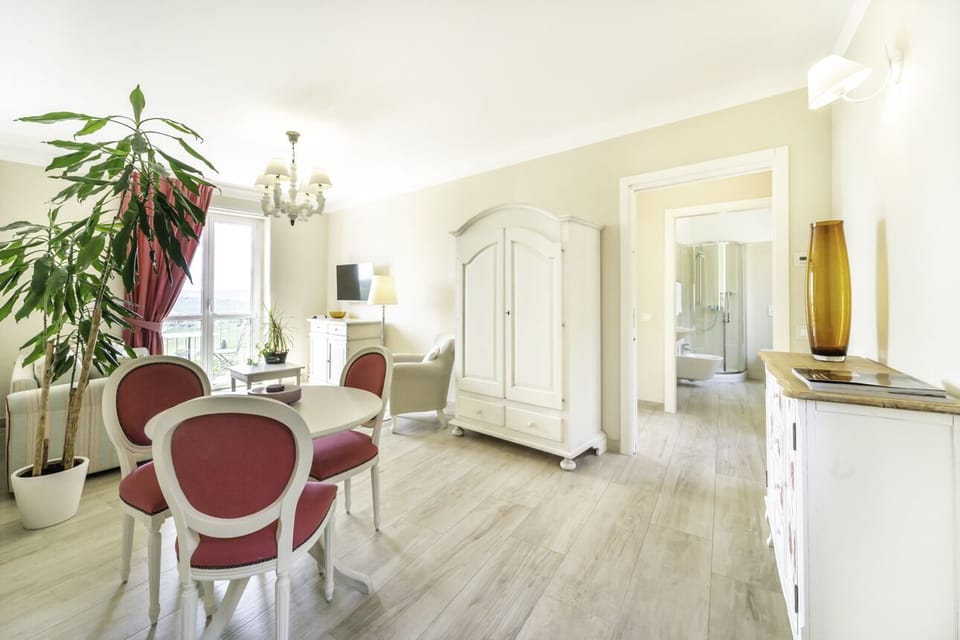 Suite, 1 King Bed, Balcony, Hill View | Living area | Flat-screen TV