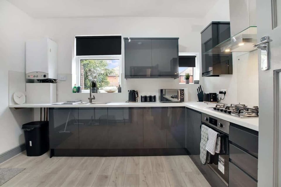 Kitchen equipped with all essentials, including a washer & dryer, oven, fridge and full cookware set.