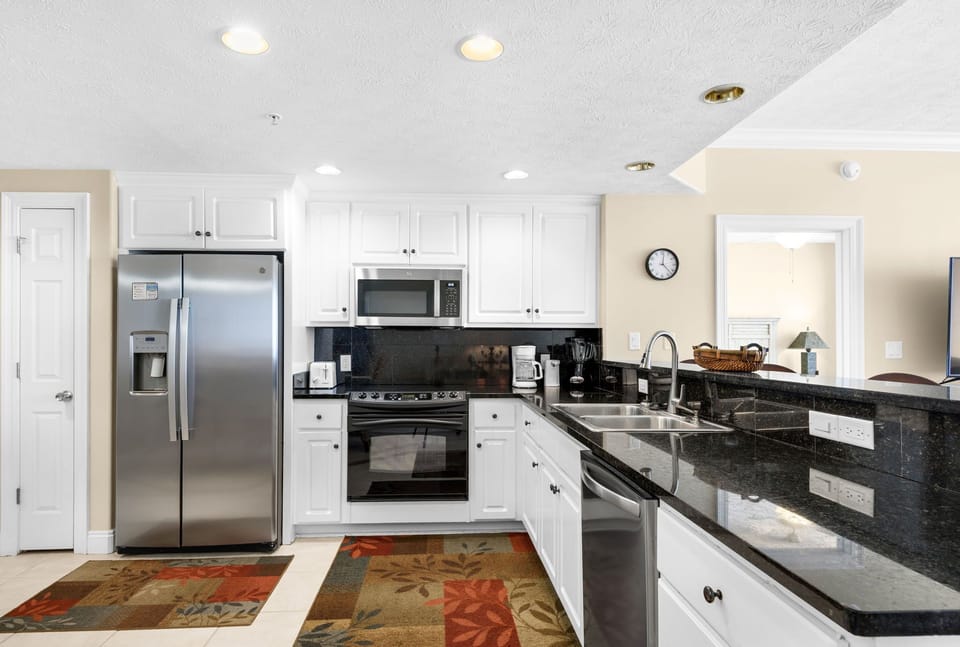 Your fully equipped kitchen sparkles with granite counters, stainless appliances, and everything you need to create memorable meals together.