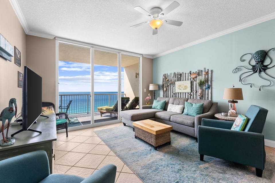 Wake up to breathtaking ocean views from your stylish living room, where coastal colors and comfy seating create your perfect beach retreat.