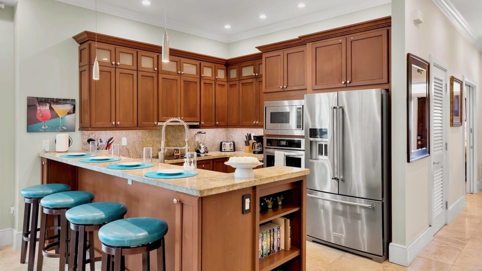 The fully equipped kitchen is stocked with every tool and appliance needed to prepare meals at home...