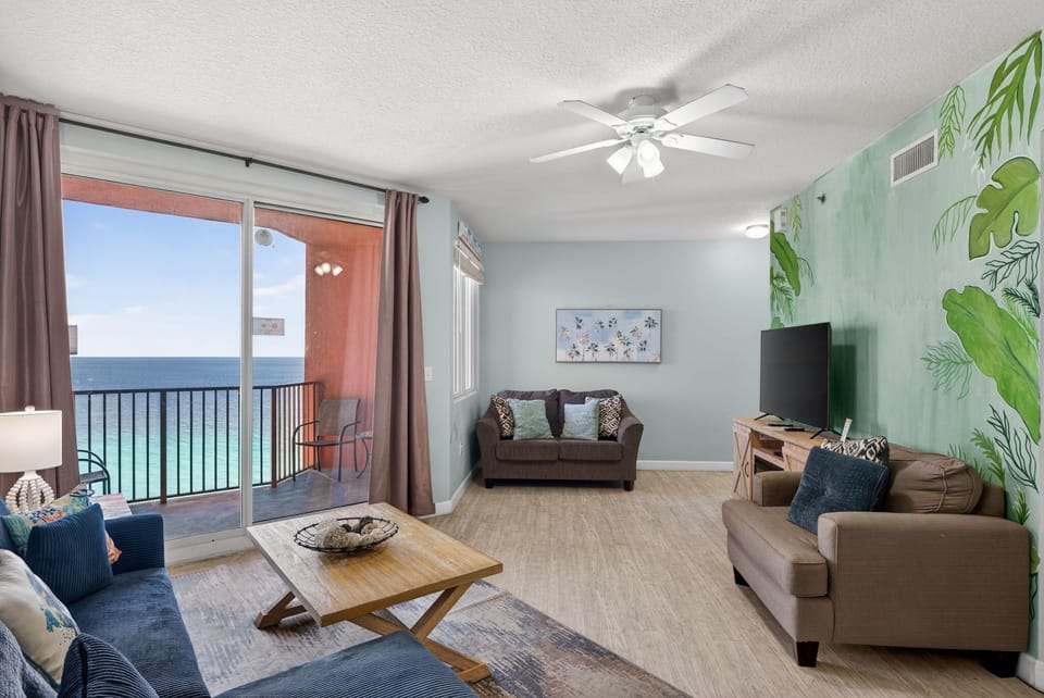 Sink into coastal comfort with stunning sea views from your private balcony and tropical-themed living space.