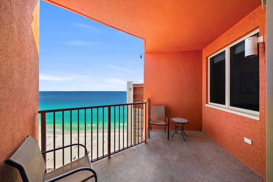 Your private balcony opens to breathtaking turquoise waters and white sand—perfect for morning coffee with ocean views.