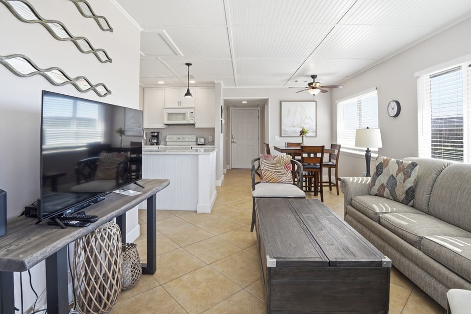 Open Living Area Connecting Kitchen & Dining – Shipwatch 300 - The open living area connects seamlessly to the kitchen and dining space, creating an easy flow for gathering, meals, and time together.